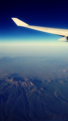 Flying over Tehran, alongside the horizon. Pretty much the reason I always pick window seats.