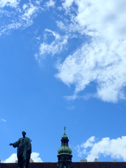 Surreal statues against a brilliant Viennese sky. 